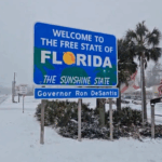Florida Sunshine state sign covered in snow